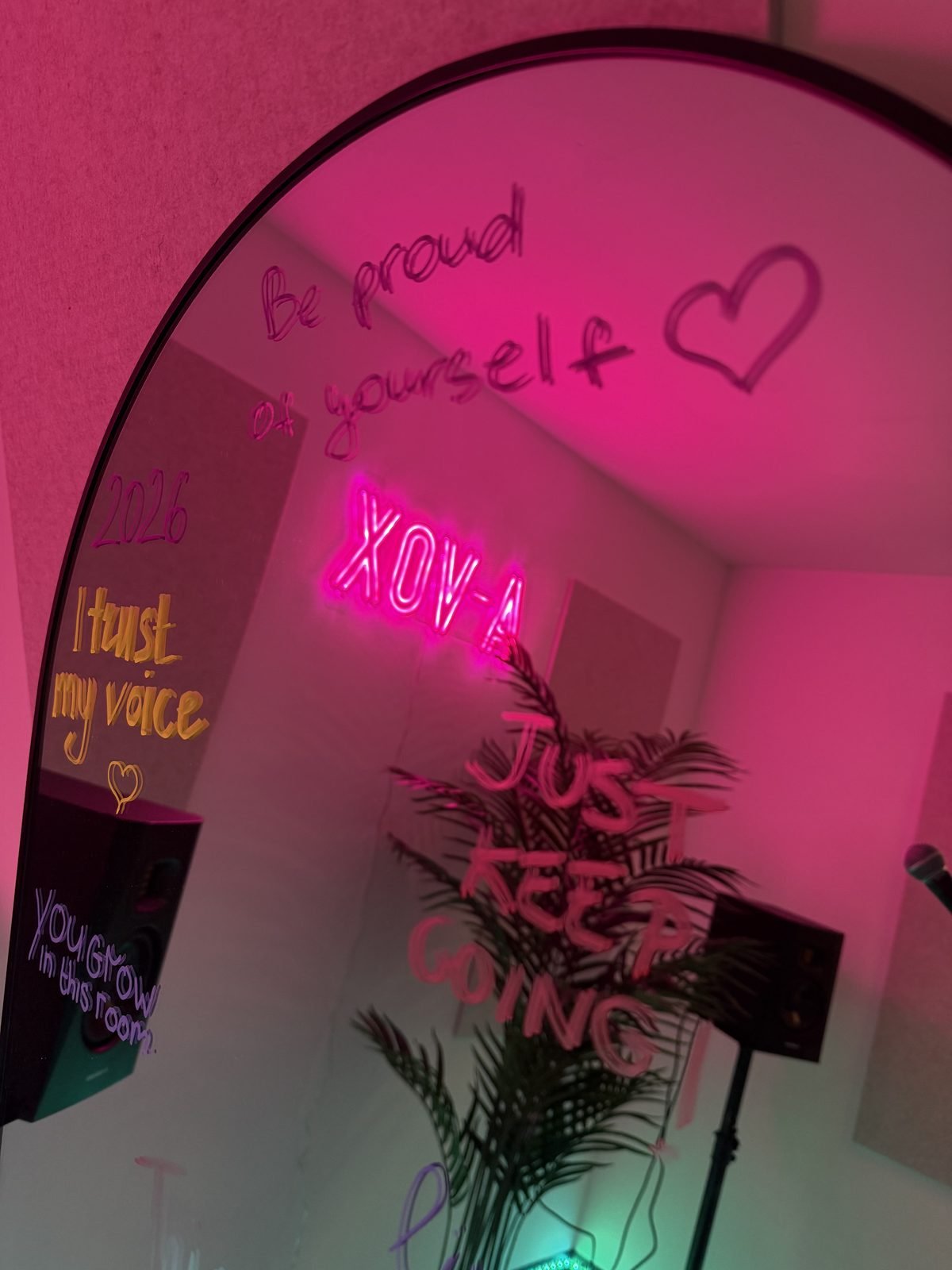 Vocal coach London — affirmation mirror at A-VOX vocal teacher London studio with XOV-A neon